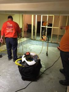 Technicians Making Renovations To A Home After A Flood