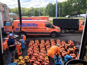 Water Damage Restoration Team Preparing For A Job