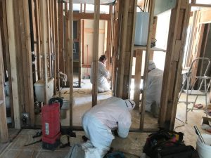 A Team Administering Complete Water Damage Restoration Services